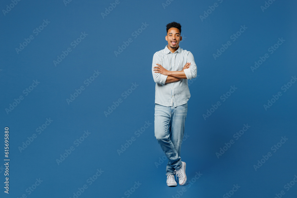 Ful body young man of African American ethnicity he wear casual clothes shirt hold hand crossed folded look camera isolated on plain dark royal navy blue background studio portrait Lifestyle concept