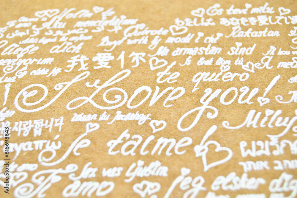 I love you phrase written in heart shape in all languages on cardboard envelope I love you phrase written in heart shape in all languages on cardboard envelope