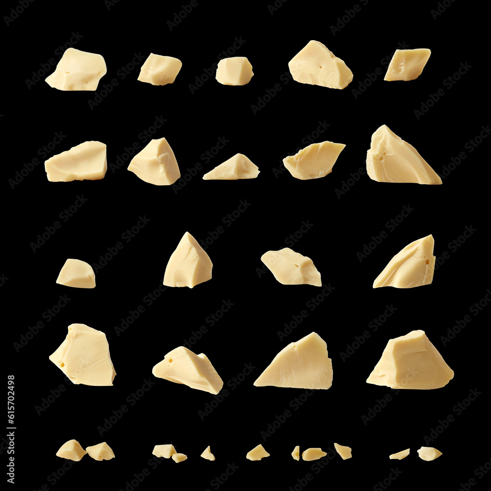 Collection of white chocolate chunks against black background. Set for stylish packaging design.