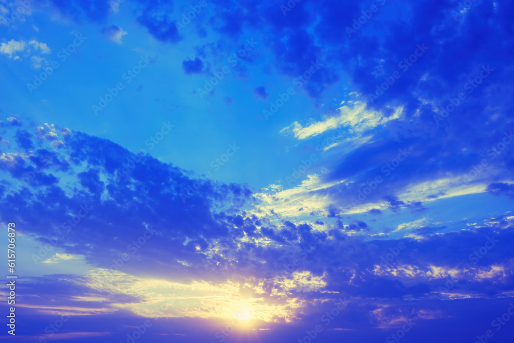Dawn sky with clouds and sun tinted in blue tones. Dawn sky with clouds and sun tinted in blue tones.