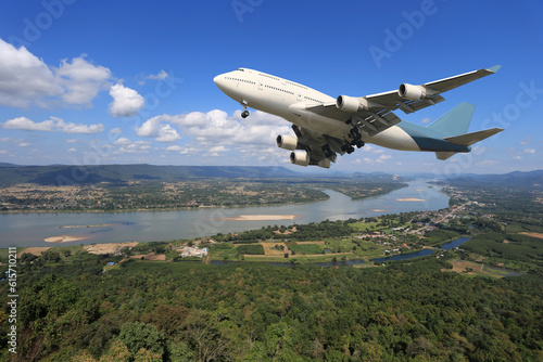 Airplane is flying above the clouds on beautiful sky background,Holidays and business concept