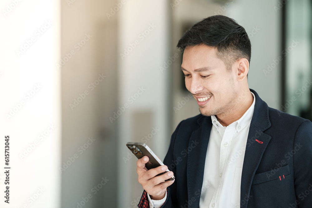 Asian business man using cell phone. Having Conversation, typing sms or presenting. Asian business man using cell phone. Having Conversation, typing sms or presenting.