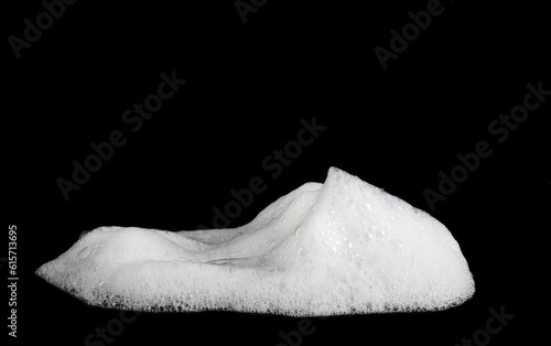 liquid white foam from soap or shampoo or shower gel Abstract soap bubbles. Set foam  soap bubble isolated on black  with clipping path texture and background.  