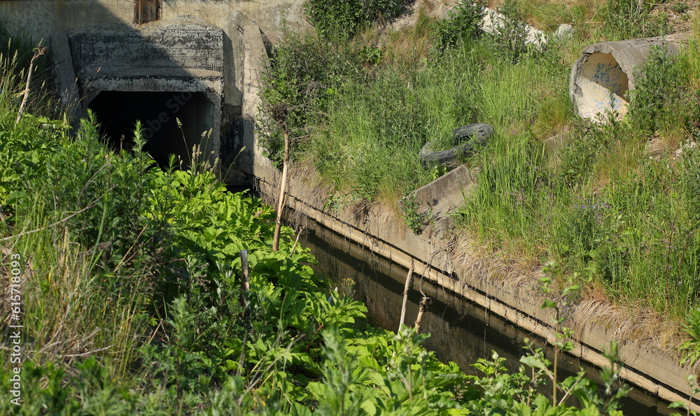 A concrete sewer and a concrete drain pipe of an old abandoned sewer A concrete sewer and a concrete drain pipe of an old abandoned sewer