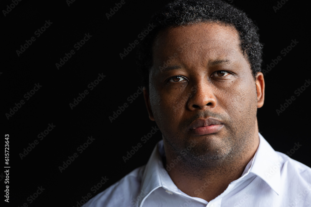 Portrait of handsome black man looking at camera Portrait of handsome black man looking at camera