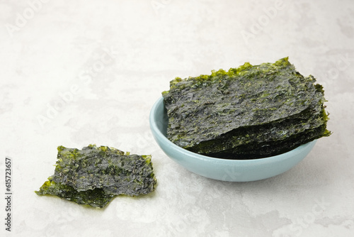 Korean Seaweed, salted nori laver sheet on a plate 
