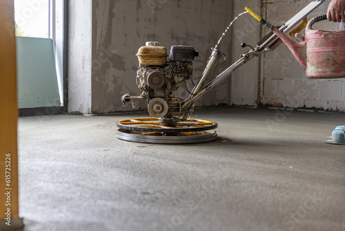 Polishing sand and cement screed floor photo
