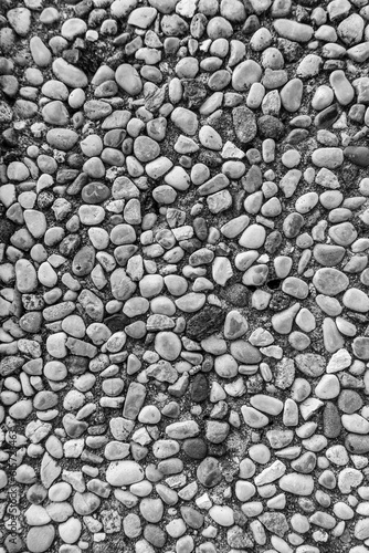 monochrome texture of old wall or pavement closeup, black and white gray background macro, wallpaper for design