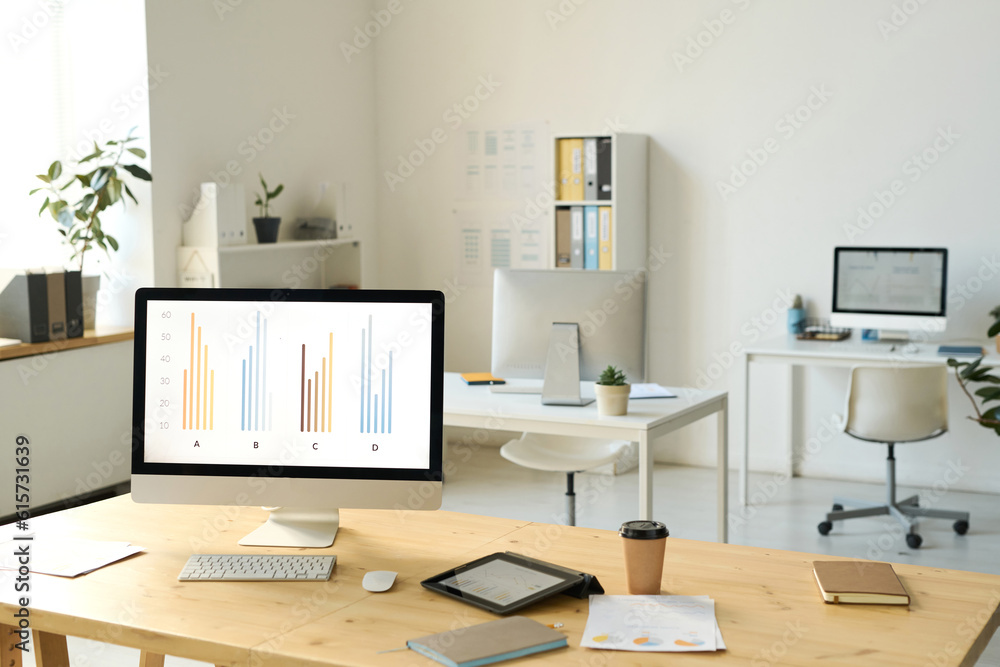 Horizontal image of workplace of business person with computer in modern office