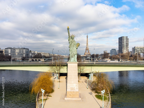 Aerial drone view of the the Statue of Liberty of Paris, France, with The Eiffel Tower in the background photo