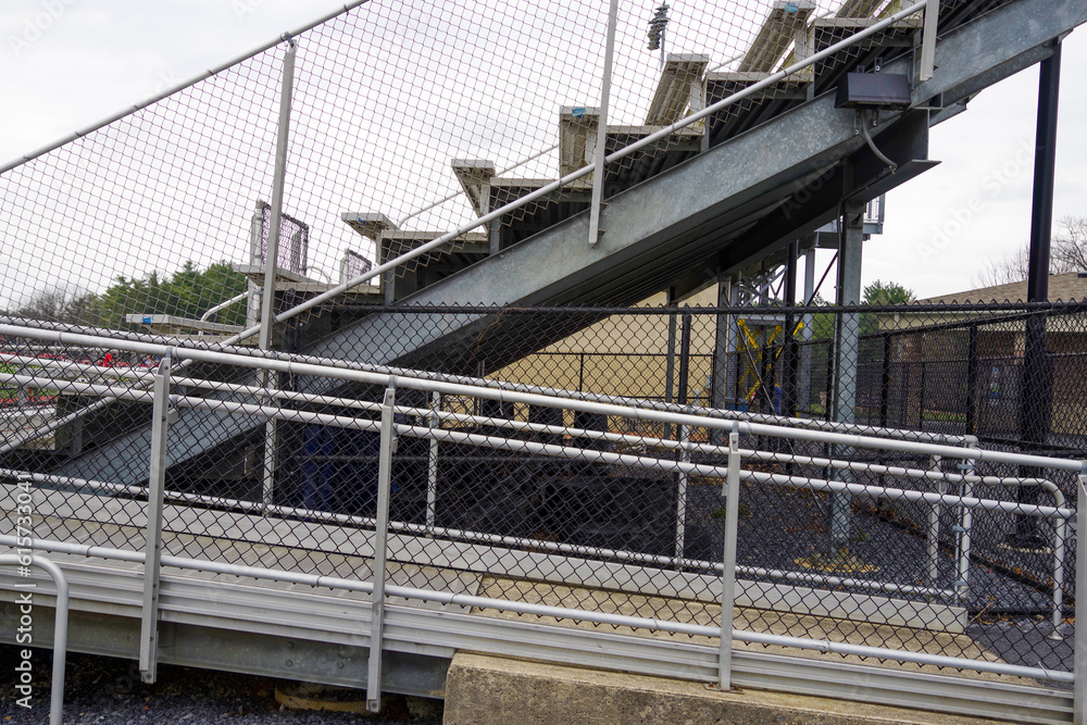 side view of empty outdoor stadioum bleachers seats and steps side view of empty outdoor stadioum bleachers seats and steps