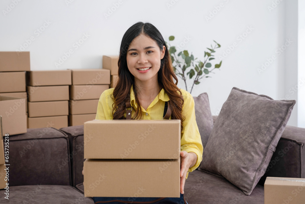 Young woman packing customer's olrder for shipment. Young woman packing customer's olrder for shipment.
