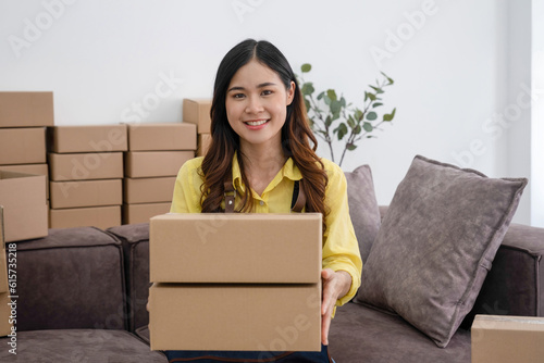 Young woman packing customer's olrder for shipment. © PIC SNIPE