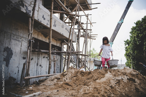 Children are forced to work in the construction area. Human rights concepts stop child abuse, violence, fear and child labor.