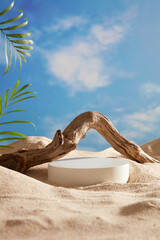 A white podium in round-shaped displayed on the sand with a big tree branch and some green tropical leaves. Blue sky background