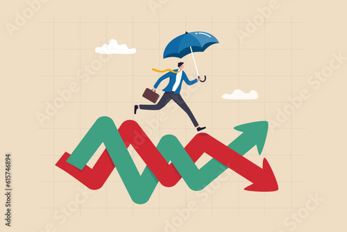 Survive and thrive in stock market volatility investment, risk management or overcome market fluctuation, uncertainty or financial challenge concept, businessman with umbrella run on volatile graph.