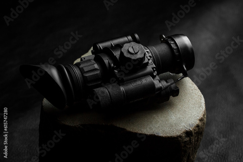 optical night vision scope on black background