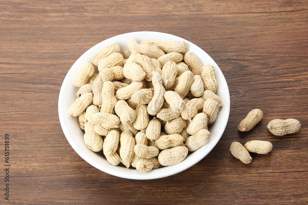 Roasted peanuts on small bowl. Copy space
