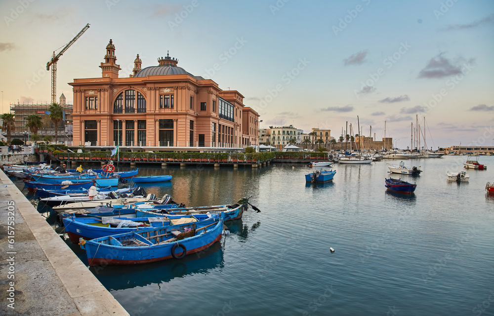 Margherita Theater and fishing boats in old harbor of Bari, Italy. Bari is the capital city of the Metropolitan City of Bari on the Adriatic Sea, Italy. Architecture and landmark of Italy