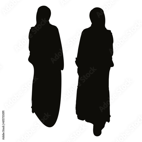 silhouette of two muslim women in long headscarves