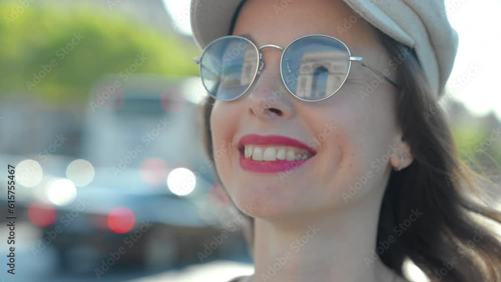 Attractive woman with Arc de Triomphe reflection in sunglasses Attractive woman with Arc de Triomphe reflection in sunglasses
