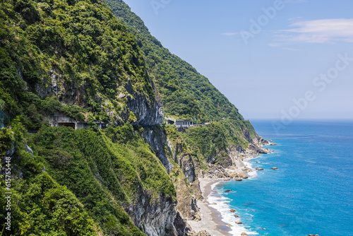 Stunning view reveals the grandeur of the cliffs at Taiwan southeast coast, Qingshui Cliff near Taroko National Park. Towering and lush, they overlook the azure sea, evoking a sense of awe. Landscape