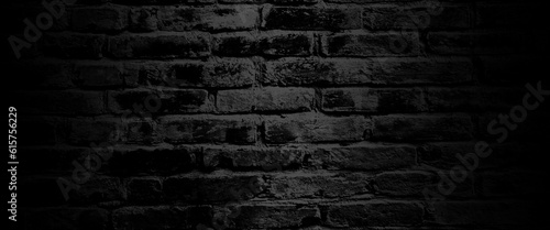Black brick wall, dark background for design, texture of a perfect black brick wall as background or wallpaper, brick surface backgrounds. black brick wall backgrounds, brick wall light room.
