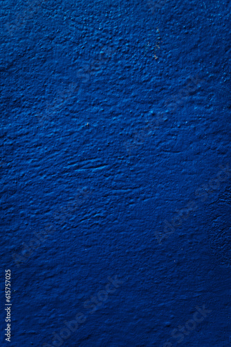 Vibrant blue wall texture  A captivating textured surface in striking blue  adding depth and character to any setting.