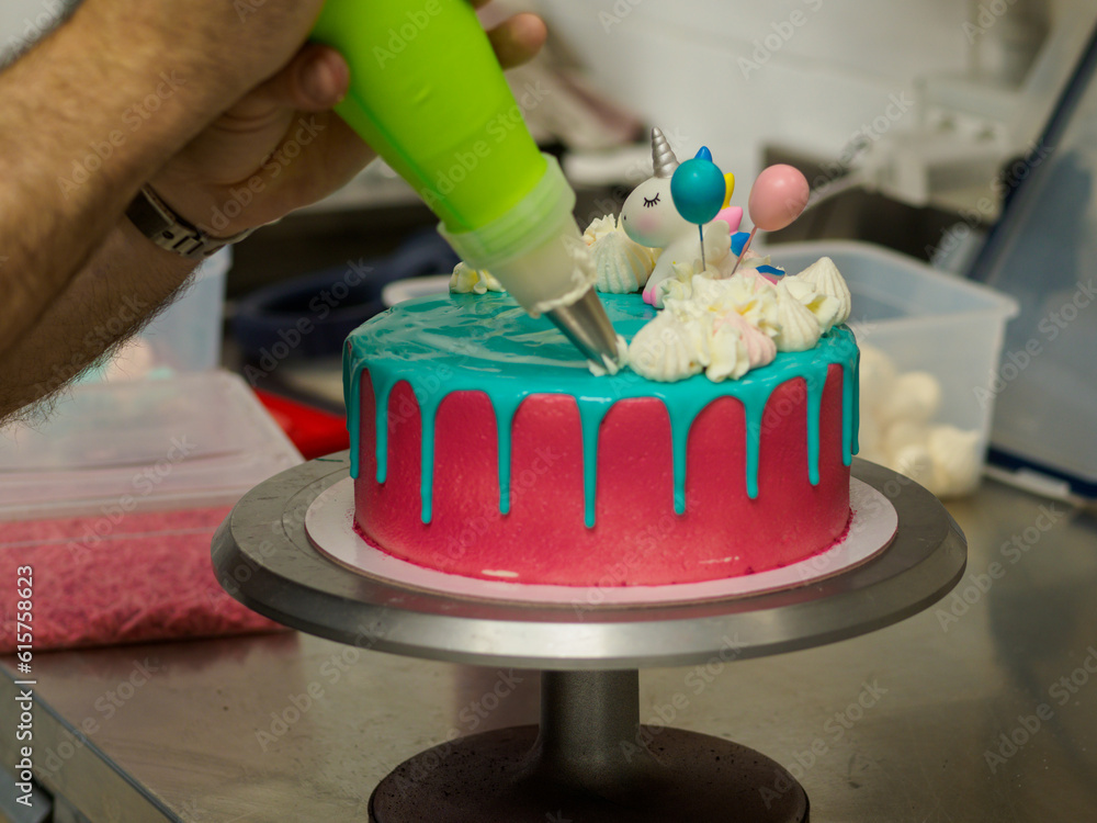 frosted pink blue cup cake with meringue, sweet sprinkles and unicorn