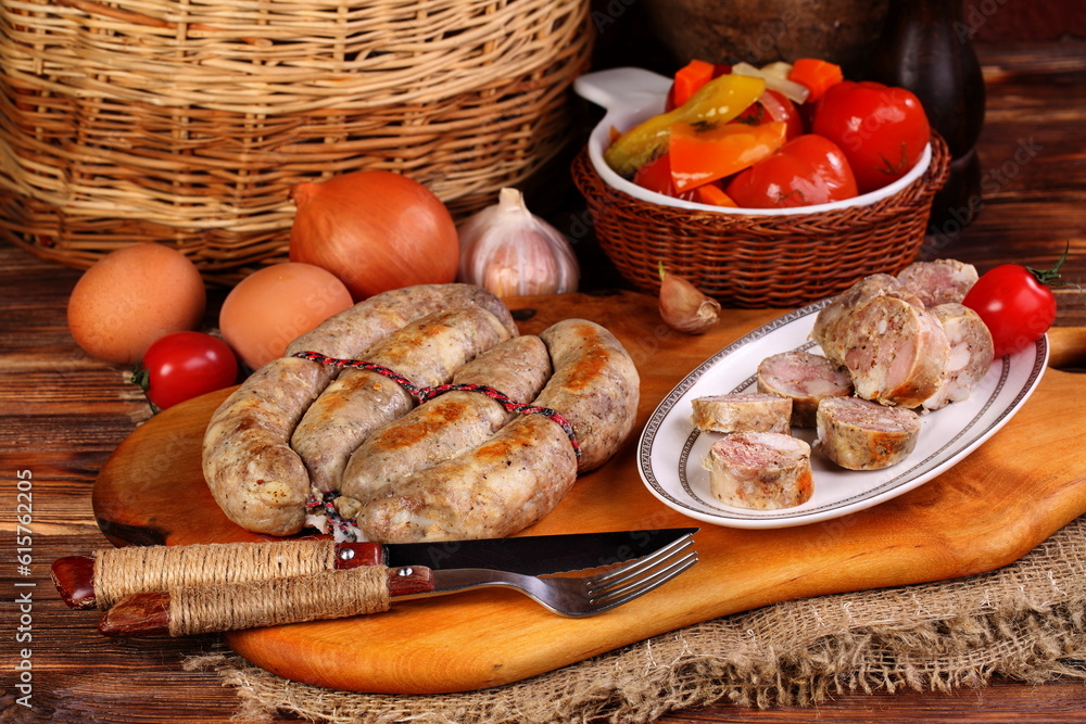Homemade sausage on wooden background