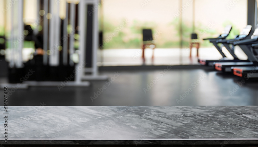 Empty black marble stone table top on blurred with bokeh Exercise room, fitness and gym interior background - can be used for display or montage your products