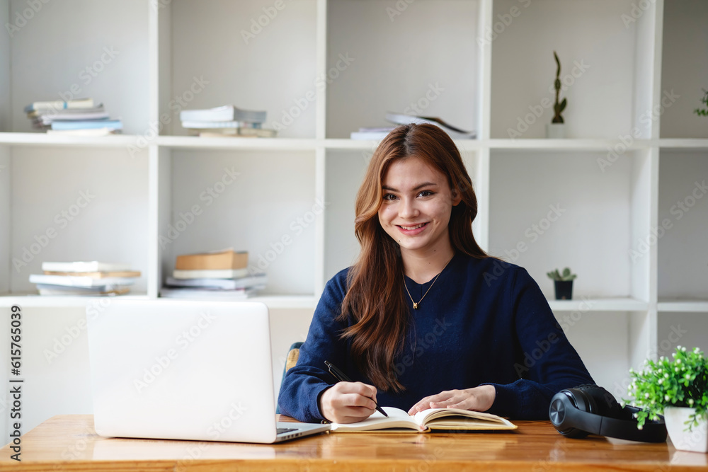 Happy young Latin female college student studying online remotely Distance university webinars Or video call on your laptop and use your computer for a virtual meeting seminar at home or on campus. Happy young Latin female college student studying online remotely Distance university webinars Or video call on your laptop and use your computer for a virtual meeting seminar at home or on campus.