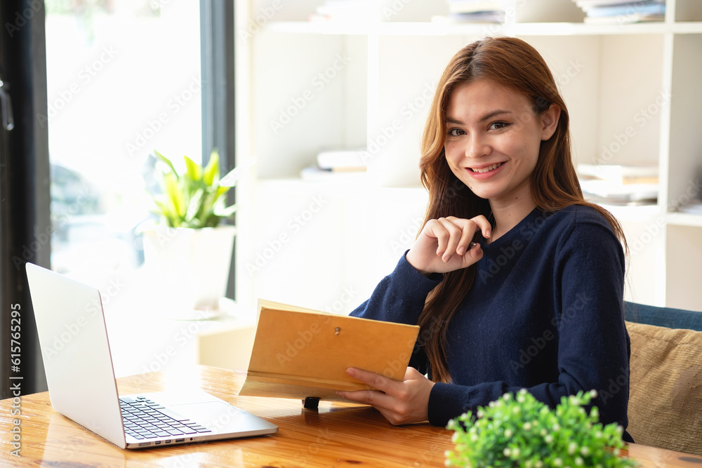 Happy young Latin female college student studying online remotely Distance university webinars Or video call on your laptop and use your computer for a virtual meeting seminar at home or on campus. Happy young Latin female college student studying online remotely Distance university webinars Or video call on your laptop and use your computer for a virtual meeting seminar at home or on campus.