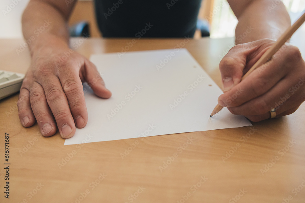 Man writing by left hand, left hander day concept