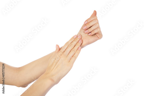 Female hands with beautiful natural manicure - pink nude nails on white background. Nail care concept