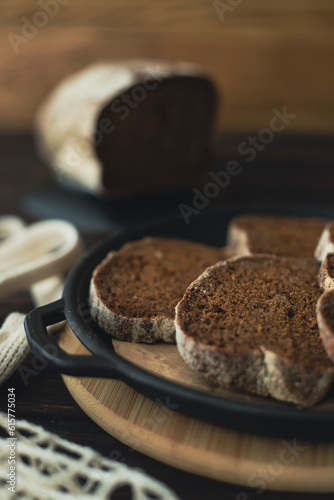 Slices of sliced black bread are laid out on a plate