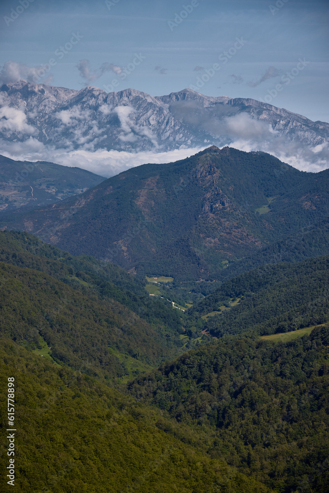 Obraz premium Valdeprado Valley and Picos de Europa. System belonging to the Cantabrian Mountains, in the regions of Asturias