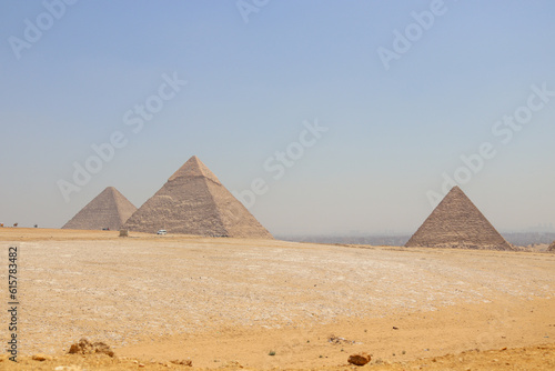 Panoramic Landscape view of Giza pyramids on a bright day