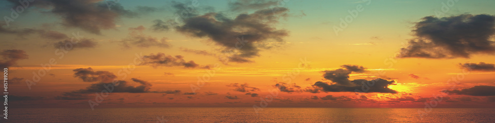 Colorful cloudy sky over the sea at sunrise. Seascape in the early morning. Sunrise over the sea. Sea view with beautiful colorful cloudy sky