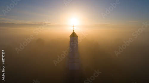 Old church on a foggy morning photo