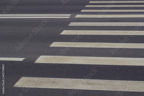 asphalt road white paint markings of pedestrian crossing.