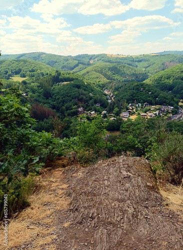 Blick auf Dirbach und Landschaft mit Hügeln und Wald in der Gemeinde Bourscheid im Norden von Luxemburg in den luxemburgischen Ardennen auf dem Wanderweg Escapardenne Lee Trail. photo