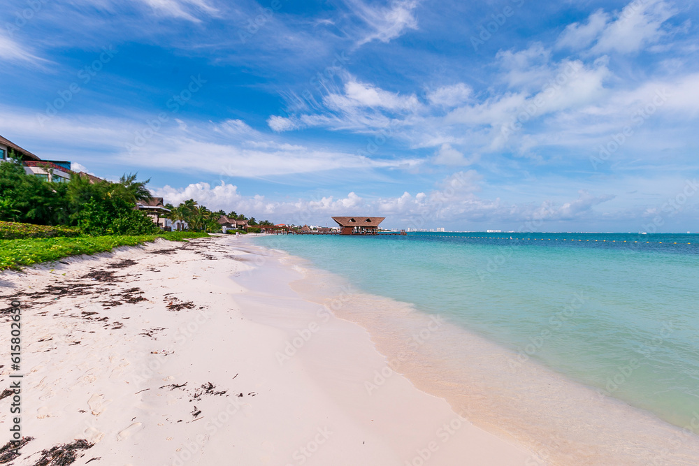 Cancun Mexico beautiful caribbean sea on a sunny day and cloudy sky. Exotic Paradise. Travel, Tourism and Vacations Concept. Tropical Resort. Cancun Mexico beautiful caribbean sea on a sunny day and cloudy sky. Exotic Paradise. Travel, Tourism and Vacations Concept. Tropical Resort.