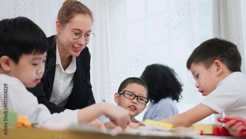 Teacher Guides Engaged Students in a World of Learning. Group of students concentrate and focus on subject during class at school. The inspiring journey as a passionate teacher leads engaged students