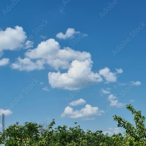 A blue sky with clouds © parpalac