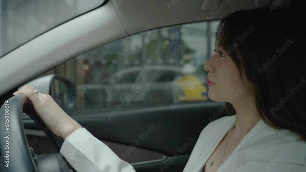 Beautiful Asian woman says to order food or drink through a screen outside the shop by driving through or drive-thru. Beautiful Asian woman says to order food or drink through a screen outside the shop by driving through or drive-thru.