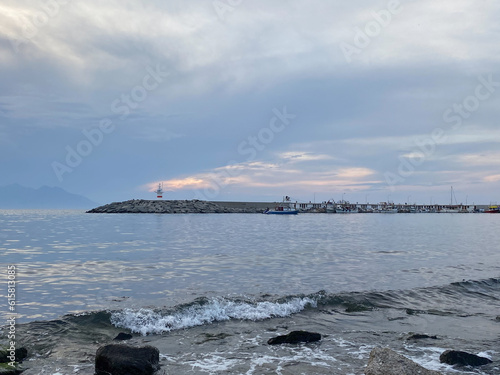 Cloudy sunset and the lighthouse view  in the evening at Gokceada Kalekoy location. Imbros island Canakkale, Turkey © Arda ALTAY