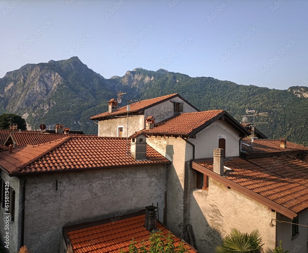 Lake Lecco, Italy. Mountains, countryside house roof landscape, early morning, sunny day, sky