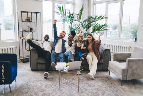 Cheerful diverse colleagues having fun together in office room