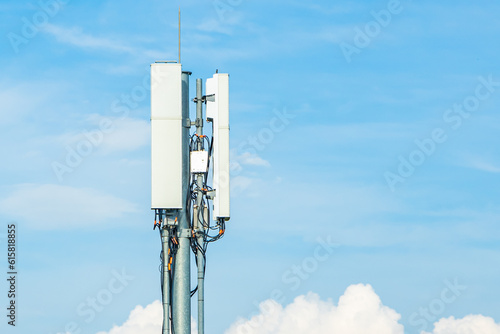 5G antenna on a telecommunication mast with a blue sky photo